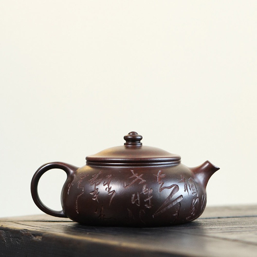 Yixing Purple Clay Calligraphy Carving Teapot